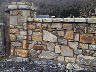 Random sandstone sizes on garden wall